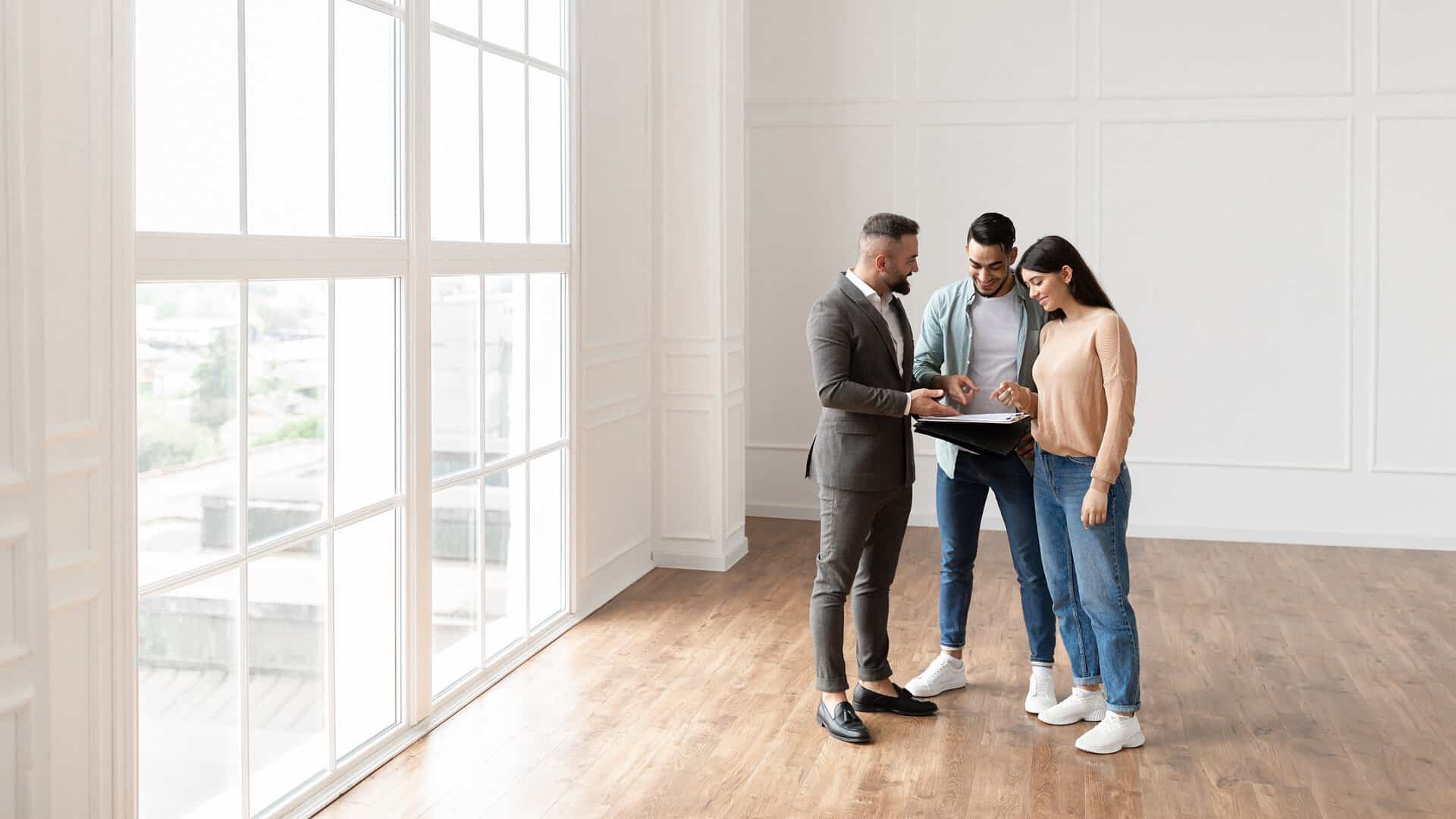 couple buying new apartment house agent showing d 2023 11 27 05 27 59 utc